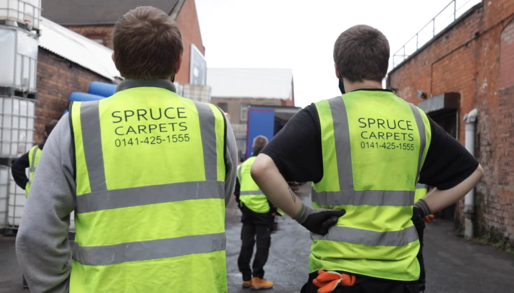 the team at spruce carpets receive delivery of recycled flooring from COP26